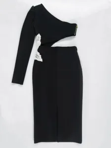 Elegant black one-shoulder bandage dress with side cutout and white floral embroidery detail