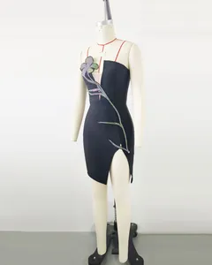 Elegant black strapless mini dress featuring colorful rhinestone flower and side slit