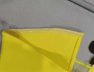 Close-up of yellow bandeau dress showing internal silicone non-slip strip detail