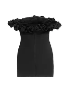 Detailed macro view of 3D fabric roses on the neckline of a black off-the-shoulder bandage dress