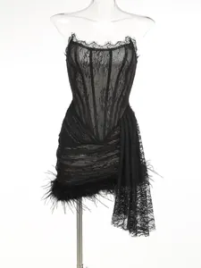Detailed view of sexy black lace corset dress with feather trim and side drape