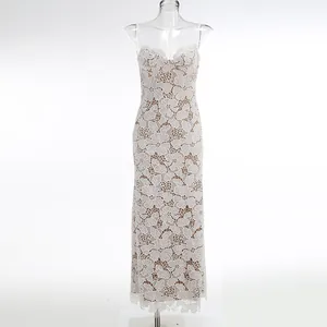 Detailed view of white floral hollow-out lace maxi dress on transparent mannequin for display