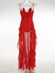 Back view of a red sequined sheer evening dress with ruffled layers on a transparent mannequin