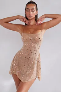 Close-up of nude sheer camisole dress with sparkling rhinestone embellishments.