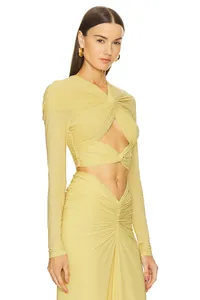 Elegant long sleeve twist cut-out dress in pale yellow for women's evening wear.