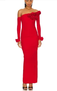 Detail of red one-shoulder bodycon dress with 3D floral accents and elegant ruching