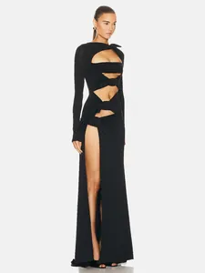 Detailed view of a sexy black long-sleeved cutout maxi dress with an extreme high leg slit