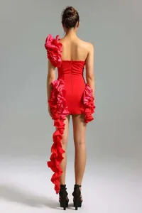 Elegant red one-shoulder bodycon mini dress featuring dramatic cascading pink ruffles on back