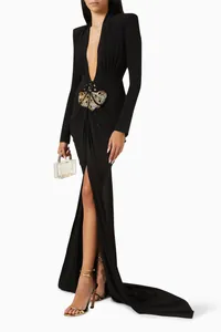 Elegant black long-sleeved evening gown featuring a deep V-neck and decorative waist accent