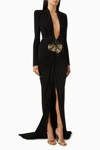 Front view of elegant black long-sleeve evening gown with deep V-neck and sequined waist