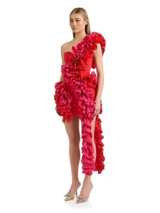 A sexy red and pink one-shoulder mini dress featuring oversized cascading ruffles detail