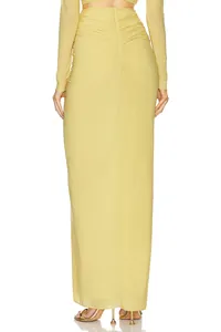 Back view of a yellow long-sleeved ruched maxi dress with elegant slim-fit design