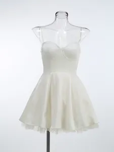 Detail view of white sweetheart mini dress with delicate lace trim and mesh lining