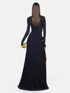 Back view of a sexy black long-sleeved maxi dress with high slit and elegant flow