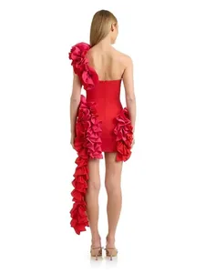 Elegant red one-shoulder cocktail dress featuring dramatic cascading ruffles shown from back