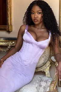 Elegant lavender satin corset dress with fishbone design shown on a model in vintage setting