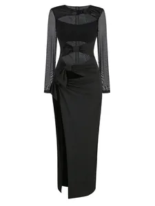 Close-up view of a sexy black sheer mesh maxi dress with cut-outs and elegant bow details