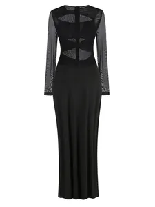Rear view of black long-sleeve maxi dress featuring sheer mesh and cut-out details