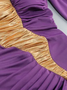 Close-up detail of purple and metallic gold ruched fabric textures on a formal evening dress
