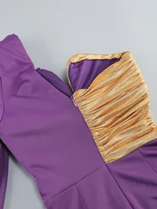 Macro view of purple one-shoulder dress featuring golden pleated texture and side zipper.