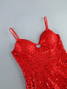 Close-up of elegant red sequined evening dress with spaghetti straps and deep V-neckline