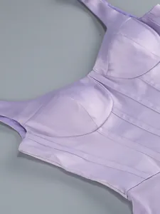 Close-up detail of a lavender satin corset bodice with structural boning on a dress