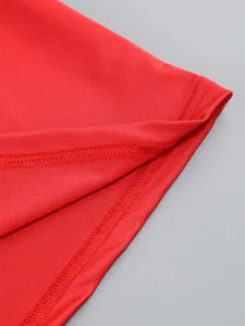 Close-up detail of high-quality stitching and fabric texture on a red slim-fit dress