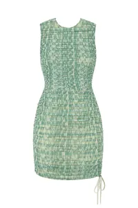 Close-up of green ruched mesh sleeveless dress showing printed texture and drawstring detail.
