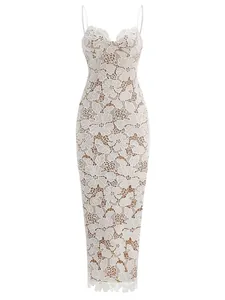 Close-up of white floral hollow-out lace detail on a slim-fit spaghetti strap midi dress