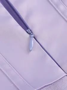 Close-up detail of smooth lavender fabric and invisible zipper on elegant gown
