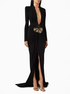 Elegant black long-sleeved floor-length dress with deep V-neck and sequined waist detail
