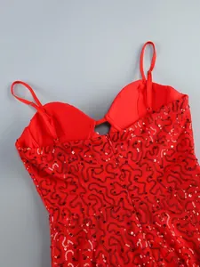 Close-up of a red sequined evening gown featuring delicate straps and a V-neckline
