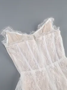 Detailed view of the intricate white eyelash lace and structural boning on the dress back