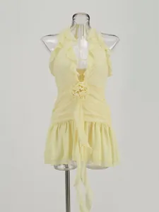 Detailed view of yellow sexy halter neck mini dress with ruffles and 3D flower decor