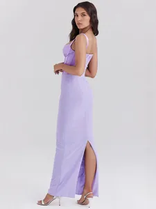 Elegant light purple corset maxi dress with back slit and thin straps shown from side view.