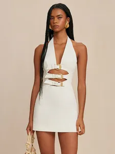 Sexy white halter neck mini dress with gold buckle cut-outs and open back details.
