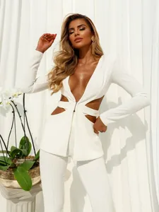 Detail view of a white two-piece suit with sexy waist cutouts and V-neckline design
