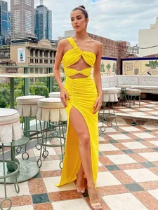 Sexy yellow one-shoulder knotted maxi dress with ruched details and a high slit