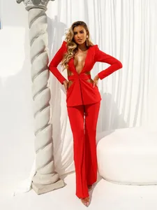 Sexy red long-sleeve blazer with deep V-neck and cut-outs with wide-leg trousers.