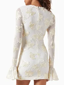 Close-up back view of white lace embroidered mini dress with 3D floral appliqué