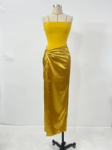 Detail view of a sexy yellow French-style slit evening dress on a mannequin.