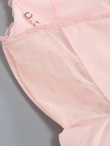 Close-up detail of pink dress featuring delicate lace trim and fine mesh lining