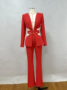 Close-up detail view of red blazer with sexy hollow waist cutout and matching flare pants.