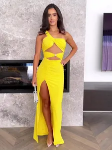 Elegant yellow one-shoulder cutout maxi dress with ruched details and a high leg slit
