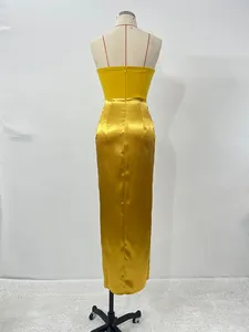 Elegant yellow satin evening dress back view displayed on a professional mannequin
