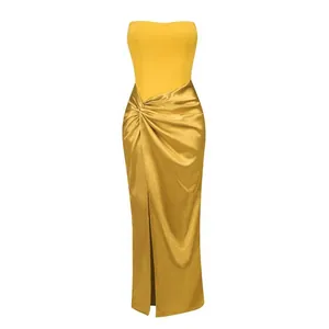 Elegant yellow satin strapless maxi dress with front slit and waist drape detail