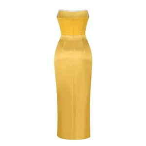 Detailed back view of an elegant yellow strapless satin evening gown with hidden zipper
