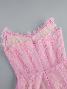 Detailed macro close-up of a pink lace bustier dress with eyelash trim and zipper