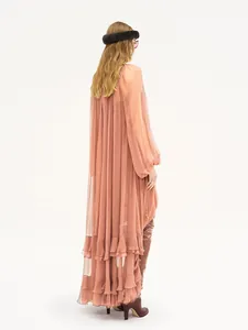 Back view of a long-sleeved sheer pink pleated maxi dress with ruffle detailing