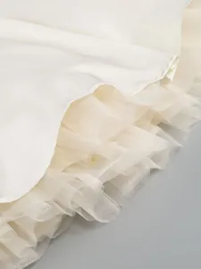 Detail of multi-layered soft mesh lining for fluffy white party dress skirt